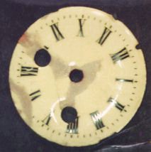 Enamel clock face before restoration.