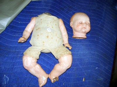 A doll before restoration work